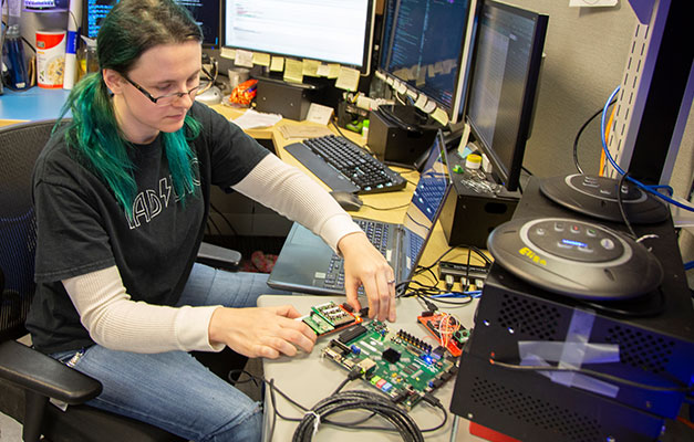 A Student Working in the Lab at Anoka Technical College.