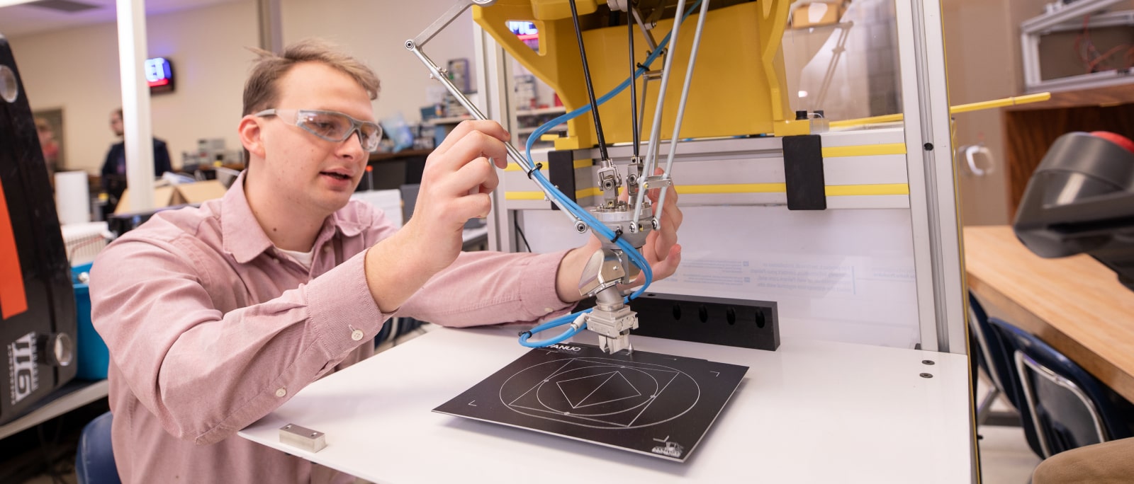 Engineering student working on a project in the lab