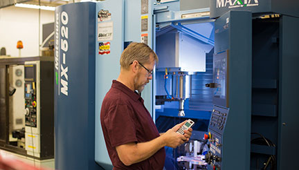 Student Paul Gustafson with Matsuura Mill