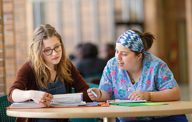 Two Nursing Students Studying in the Cafeteria. 
