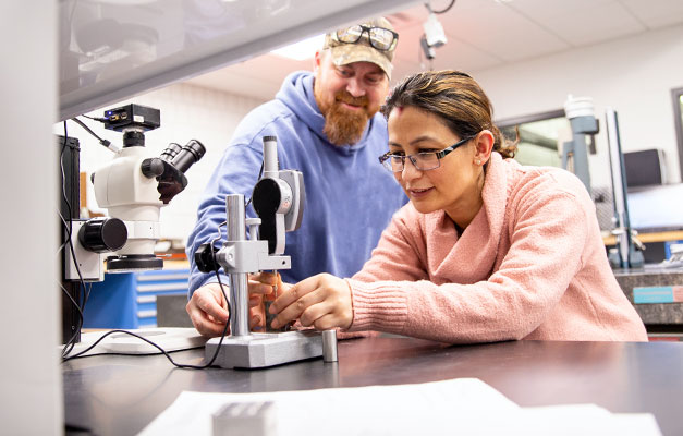 Quality Technician Students Working with Equipment in the Lab. 