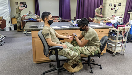 National Guard members in CNA lab at Anoka Tech