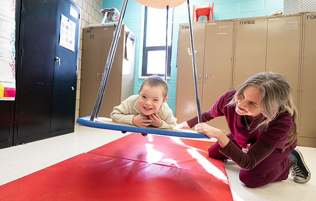 Occupational Therapy Student Working with a Child. 